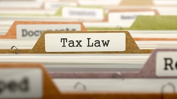 Tax Law - Folder Register Name in Directory. Colored, Blurred Image. Closeup View.-1